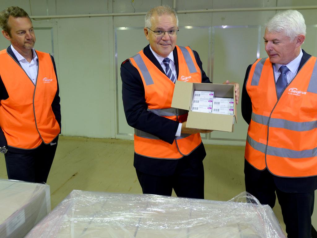 Prime Minister Scott Morrison with a palette of COVID vaccine at CSL Melbourne. Picture: NCA NewsWire / Andrew Henshaw