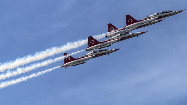 24th April 2015- Ceremony at Cape Helles British Memorial to mark the 100th anniversary of the Battle of Gallipoli. Present are Australian many dignitaries minister Tony Abbott, Prince Harry, Prince Charles, New Zealand Prime Minister John Key and President of Turkey Recep Tayyip ErdoÄŸan. Turkish airforce NF-5. Pic Ella Pellegrini