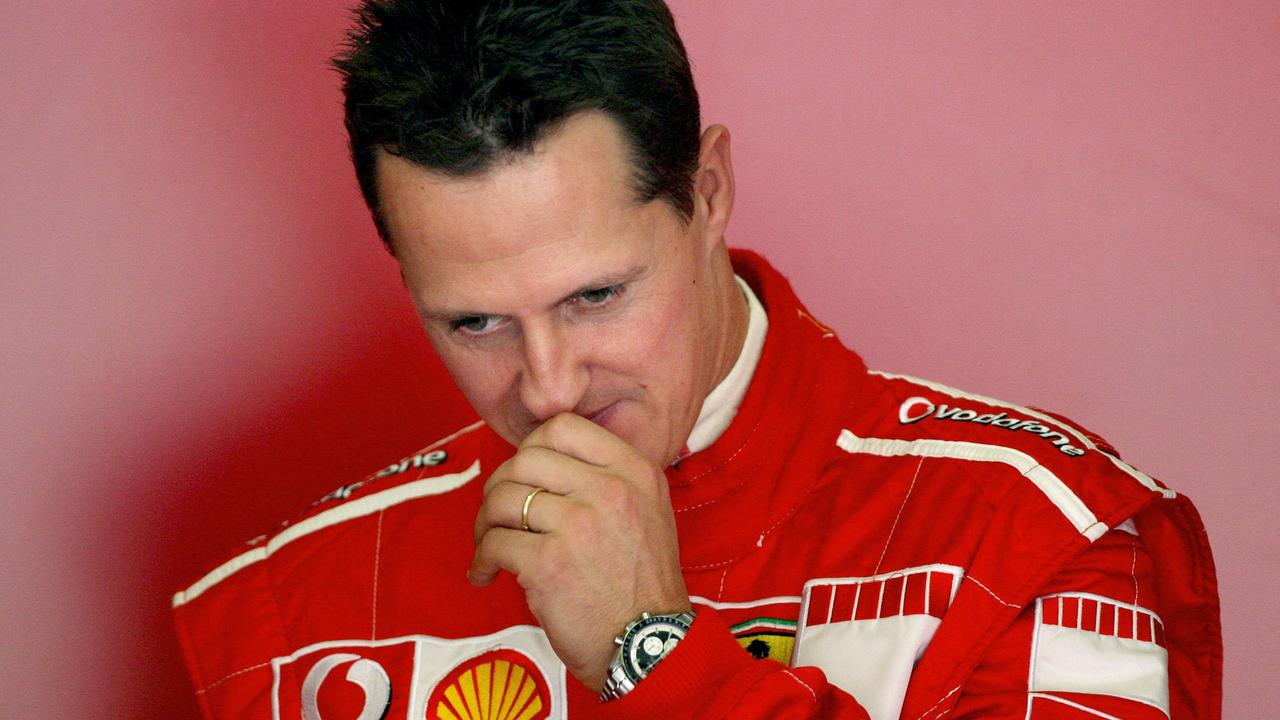 Michael Schumacher ponders during a training session. Photo by JOSE LUIS ROCA / AFP.