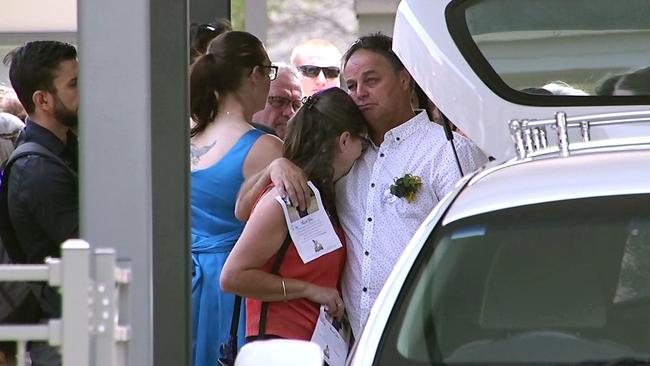 Karen and Craig Griffiths comfort each other at the funeral of their son Jason in Coffs Harbour on Monday. Picture: Frank Redward