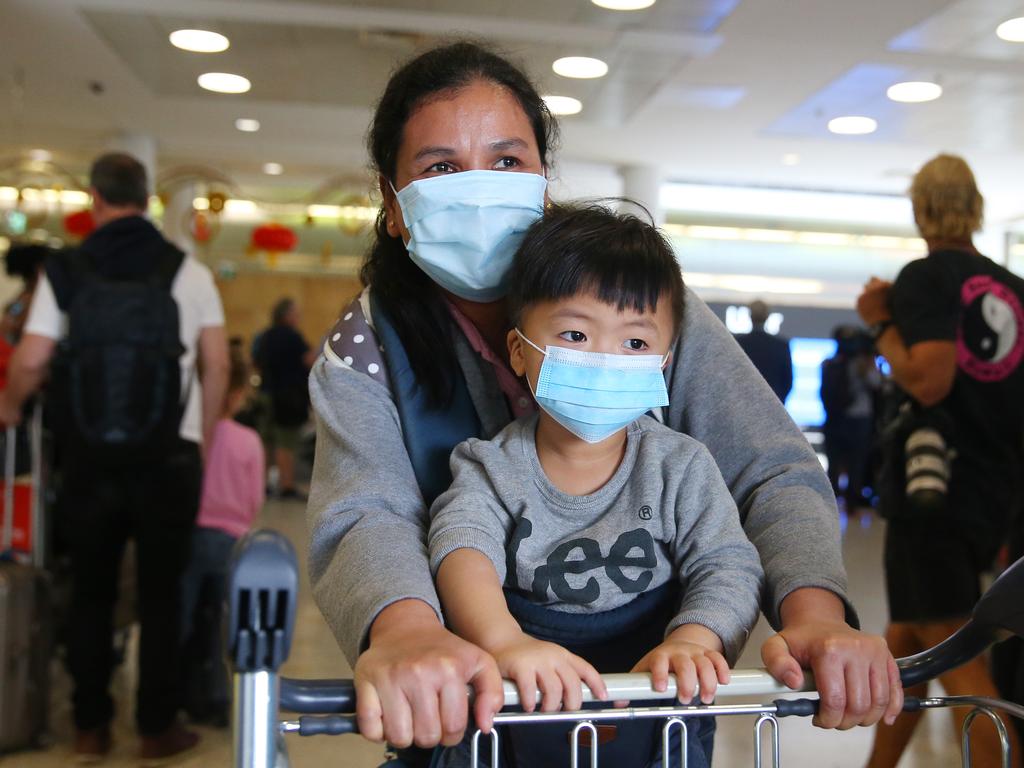 Passengers arrive in Sydney after a flight from Wuhan. Picture: Don Arnold/Getty Images)