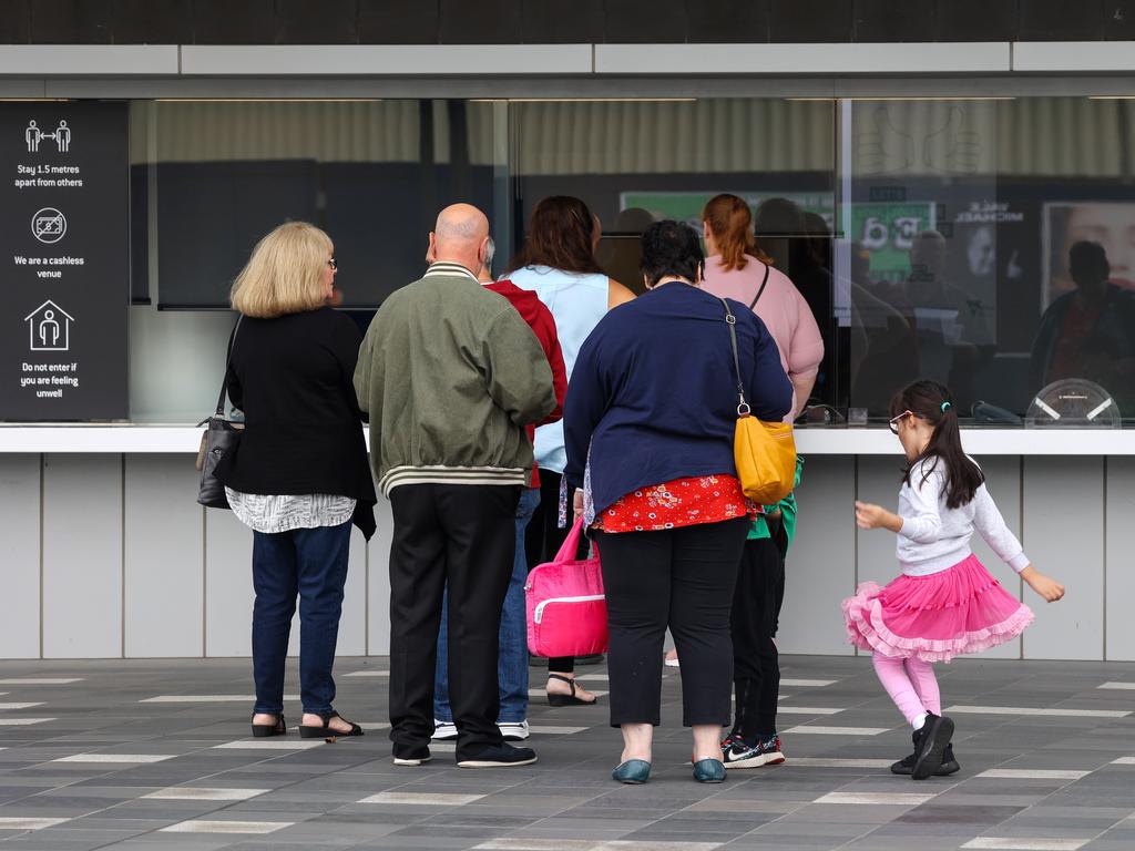 People start to arrive to collect their tickets. Picture: NCA NewsWire / Ian Currie