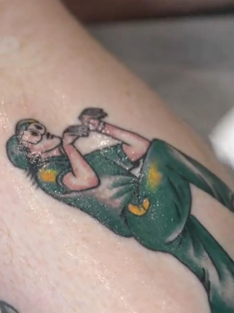 A man gets a Raygun tattoo. Photo: TikTok