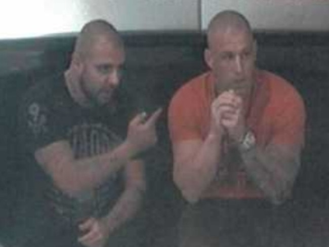 Farhad Qaumi and Pasquale Barbaro talk at a table in the food court area of The Star casino.