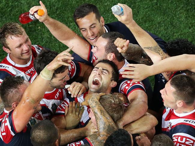 Outgoing Roosters legend Anthony Minichiello celebrates with teammates at full-time after winning the 2013 NRL Grand Final against the Manly Sea Eagles. (Photo by Mark Metcalfe/Getty Images)