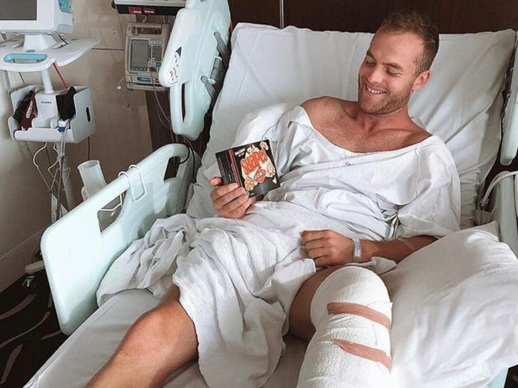 Tom Mitchell in his hospital bed after suffering a broken leg. Picture: Instagram