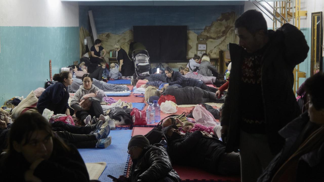 Hundreds of Kyiv residents from a residential building damaged by a missile gather in a bomb shelter in the basement of a school on February 25. Picture: Pierre Crom/Getty Images