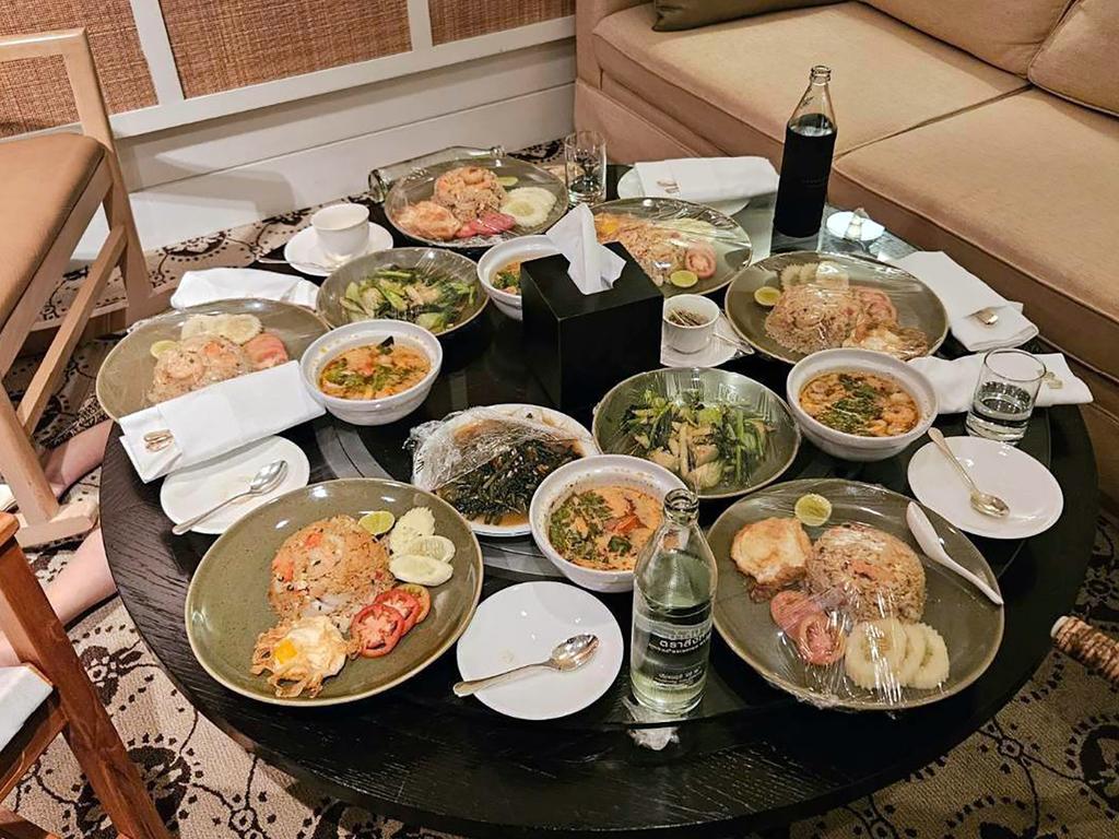 A photo issued by Royal Thai Police shows food on a table inside the room where the six were found dead – the food was untouched. Picture: AAP