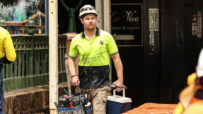 Workers leave the Probuild worksite at Queen Street, Brisbane. Picture: Zak Simmonds