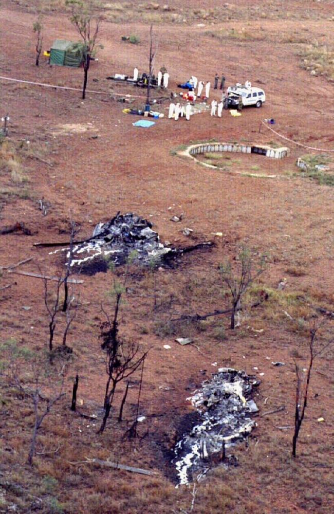 The charred remains of two Black Hawk helicopters at the High Range Army Training area, outside of Townsville, after they crashed during a Special Air Service Regiment training exercise in June 1996, killing 18 soldiers. This crash prompted Kerry Danes to start a medal campaign that has now been ongoing for 25 years. Picture: Supplied