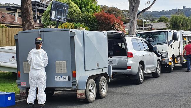 Clandestine laboratory squad packing up after spending hours taking samples from the Dromana scene.