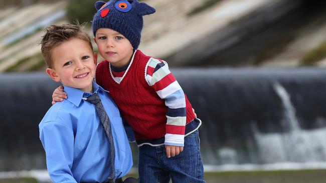 Louis Kempster, 5, pulled his younger brother, Astor, 2, from the mouth of the Torrens at West Beach.  Picture: Dean Martin