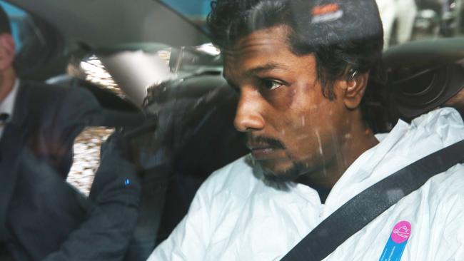 The man arrested aboard the Malaysia Airlines flight is driven into the Melbourne Magistrate’s Court today. Picture: AAP