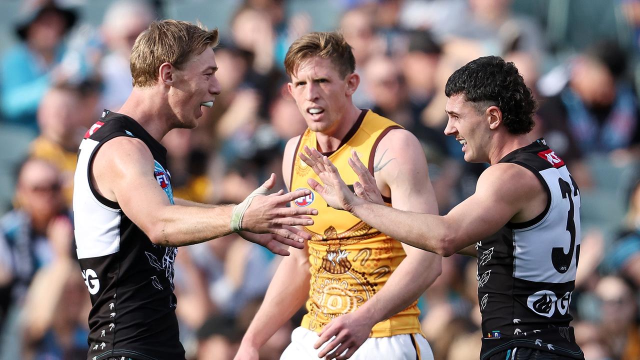 Todd Marshall and Darcy Byrne-Jones celebrate a goal on Saturday. Picture: Sarah Reed/AFL Photos