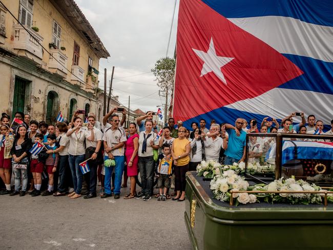 Daily Life - First Prize, Stories © Tomas Munita, for The New York Times Title: Cuba On The Edge Of Change Fidel Castro’s funeral procession in Santa Clara, Cuba. Cuba declared nine days of mourning after Fidel Castro’s death, a period that culminated with his funeral. Story: For many, the death of Fidel Castro felt like that of a father. In death, as in life, Fidel Castro demanded reverence. Cuba brims with life, a contrast drawn sharper amid its faded grandeur. From one end of the country to the other, thousands of Cubans waited to bid farewell to Fidel.
