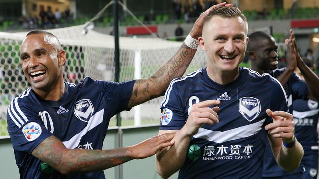 Melbourne Victory's Archie Thompson celebrates Tuesday night’s ACL win with Besart Berisha. Picture: George Salpigtidis