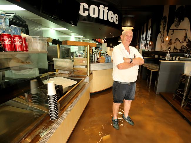 John Rees, owner of Blueys Cafe in Woodlark St, surveys the damage. Picture: Nathan Edwards