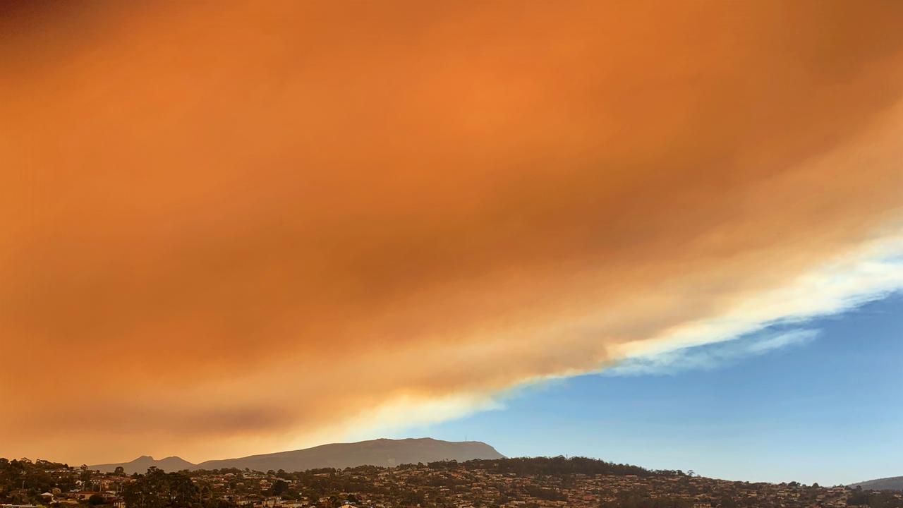 Bushfire smoke is seen over Blackmans Bay in Hobart. Picture: EMILY QUINTIN