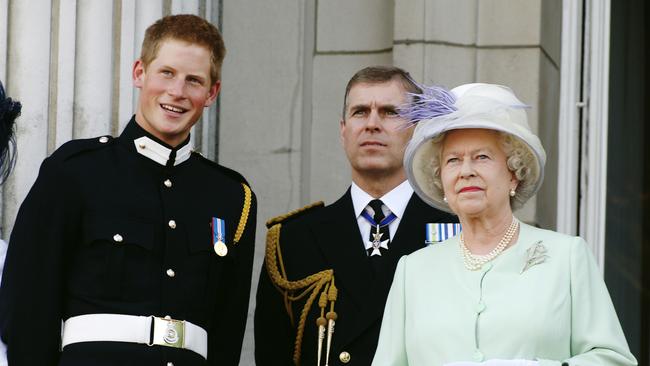 Prince Andrew, middle, with Prince Harry and the Queen on National Commemoration Day in 2005. Picture: Anwar Hussein/Getty