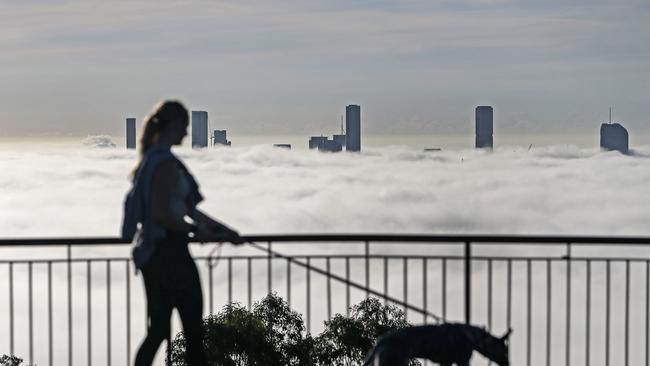 Brisbane City covered in fog, seen from the Mt Coot-Tha Summit Lookout. Picture: Zak Simmonds