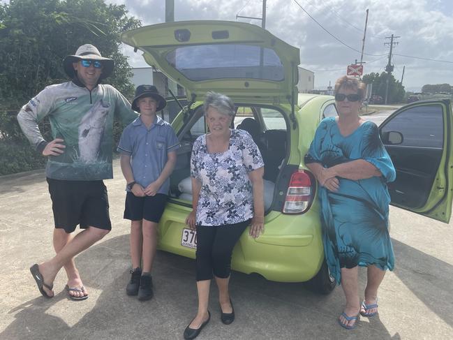 Luke and Jackson Paroz, Janet Morris and Mary Eglington in front of the SES station in Proserpine filling up bags of sand ahead of cyclone Kirrily. Picture: Estelle Sanchez