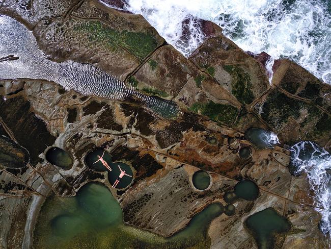Figure Eight Pool Royal National Park near Burning Palms beach. Tourists enjoy a swim and take photos. Figure Eight Pools is located on a dangerous rock platform in Sydney’s Royal National Park. Figure Eight Pools is located in Royal National Park, near Burning Palms Beach. This coastal rock shelf is dotted with natural rockpools including one in the shape of a figure eight. Picture: Rohan Kelly