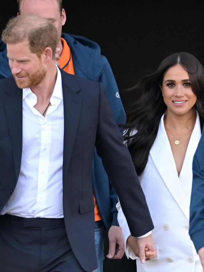 The couple held hands and looked relaxed as they arrived with a Netflix crew in tow. Picture: AFP