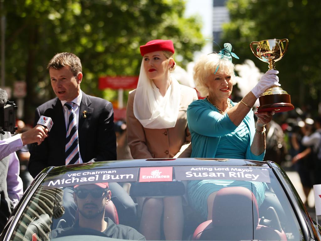 Acting Lord Mayor Susan Riley (R) holds the Melbourne Cup alongside VRC Chairman Michael Burn (L) during  the 2014 Melbourne Cup parade on November 3, 2014 in Melbourne, Australia. Picture: Getty