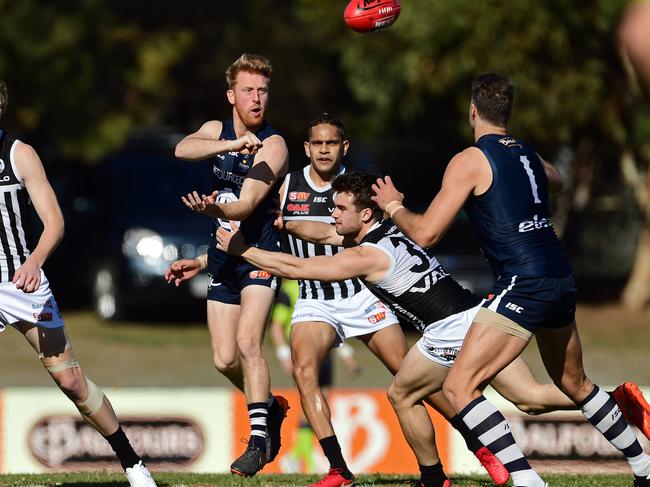 03/06/18 - SANFL: South Adelaide v Port Adelaide at Hickinbotham Oval.  South's Nicholas Liddle fires out a handpass.Picture: Tom Huntley