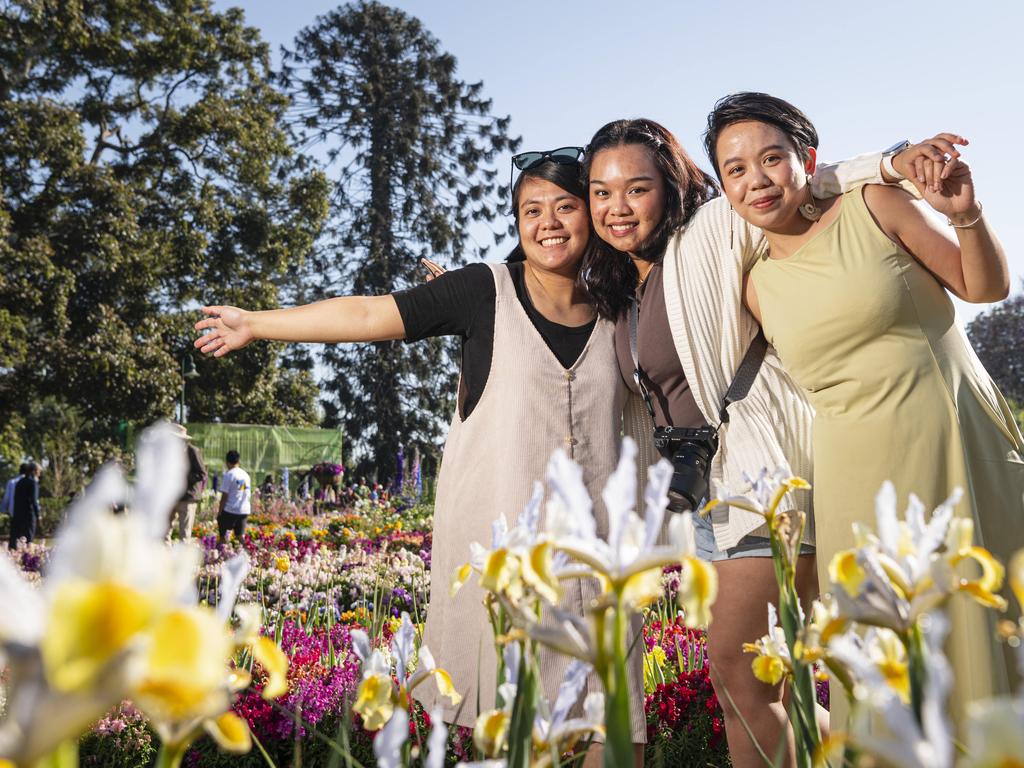 Visiting from Brisbane are (from left) Charmaine Fernandez, Zy Maglaqui and Verelyn Ogbac in Queens Park for Carnival of Flowers, Saturday, September 21, 2024. Picture: Kevin Farmer