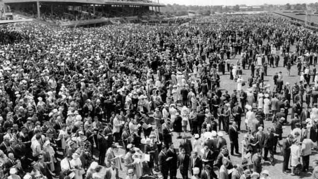 Thousands of racegoers attend a packed-out Flemington in 1963.