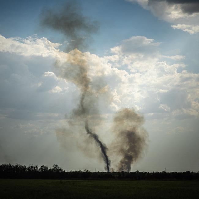 Smoke rises at the front line in Mykolaiv Oblast, north of Kherson. Picture: AFP