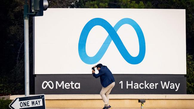 A man takes a photo at Meta corporate headquarters in Menlo Park, California. Picture: Josh Edelson / AFP