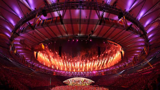 RIO DE JANEIRO, BRAZIL - AUGUST 05: Fireworks explode over the stadium during the Opening Ceremony of the Rio 2016 Olympic Games at Maracana Stadium on August 5, 2016 in Rio de Janeiro, Brazil. (Photo by Patrick Smith/Getty Images)