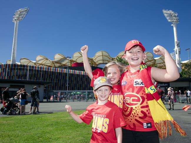 Ace (5) and Aria Franklin (7) with Kaan Kirikci (9) before the Gold Coast Swans take on the Sydney Swans at People First Stadium, Carrara. Picture: Glen Campbell