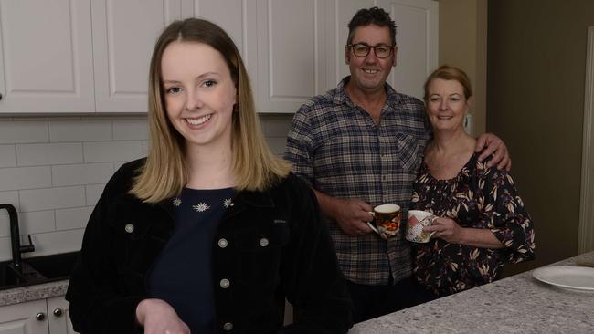 Mairead Dullard back at the family home in Bendigo with parents Paul and Lisa on Wednesday. Picture: Daryl Pinder