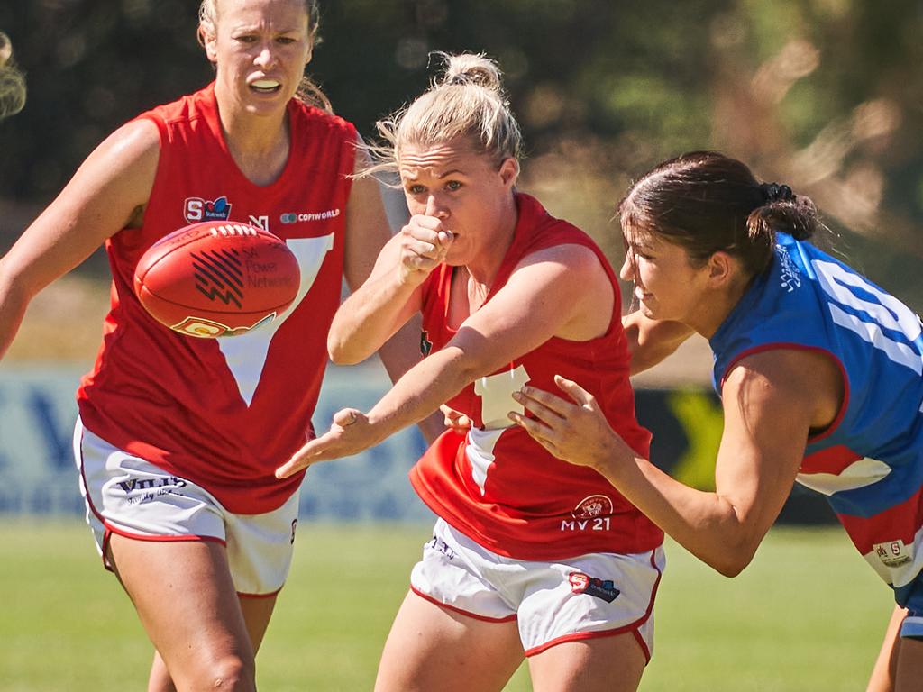 Lauren Daniel getting tackled by Shannon Murphy at X Convenience Oval, in the SANFLW match between Central District and North Adelaide, Saturday, Feb. 22, 2020. (AAP Image/MATT LOXTON)