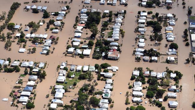 In a 1200km-long path of destruction, Debbie left 14 people dead, and a $2 billion damage bill. Above, floodwaters engulf Depot Hill in Rockhampton in Debbie’s aftermath. Photo: AAP