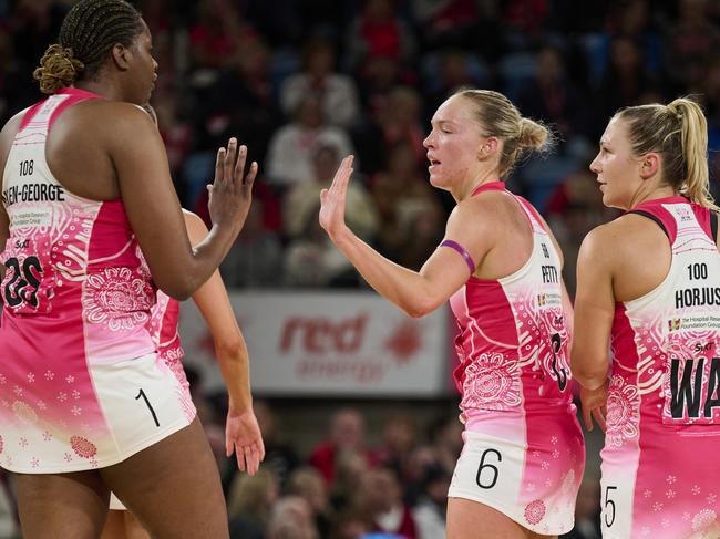 SYDNEY, AUSTRALIA - JULY 07: Hannah Petty of the Thunderbirds celebrates with Romelda Aiken-George of the Thunderbirds during the round 13 Super Netball match between NSW Swifts and Adelaide Thunderbirds at Ken Rosewall Arena, on July 07, 2024, in Sydney, Australia. (Photo by Brett Hemmings/Getty Images)