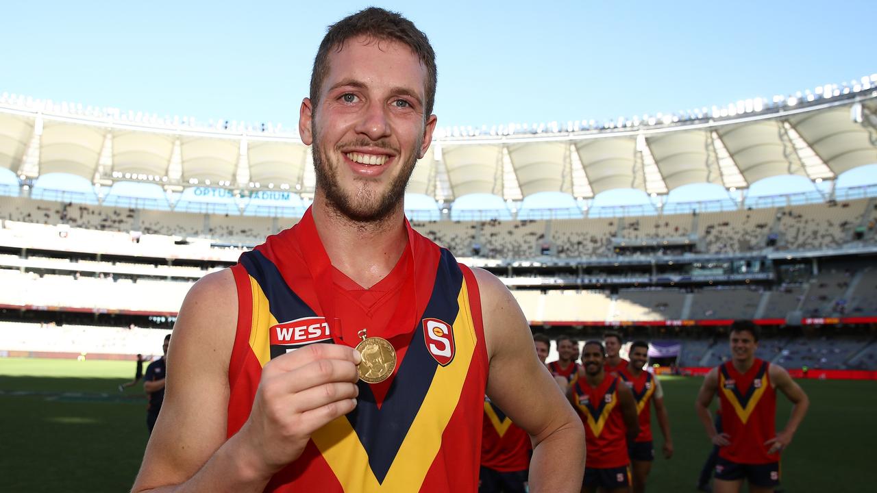 PERTH, AUSTRALIA - MAY 12: Michael Knoll of the SANFL poses with the Foss-Williams medal for best SANFL player during the state game between WA and SA at Optus Stadium on May 12, 2019 in Perth, Australia. (Photo by Paul Kane/Getty Images)