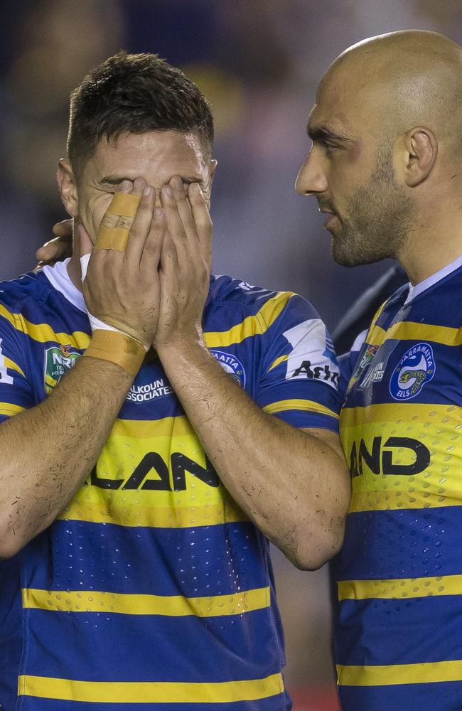 A shattered Mitchell Moses with Tim Mannah after missing the final conversion.