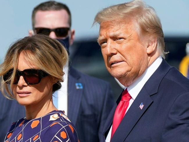 Outgoing US President Donald Trump and First Lady Melania arrive at Palm Beach International Airport in West Palm Beach, Florida, on January 20, 2021. - President Trump and the First Lady travel to their Mar-a-Lago golf club residence in Palm Beach, Florida, and will not attend the inauguration for President-elect Joe Biden. (Photo by ALEX EDELMAN / AFP)