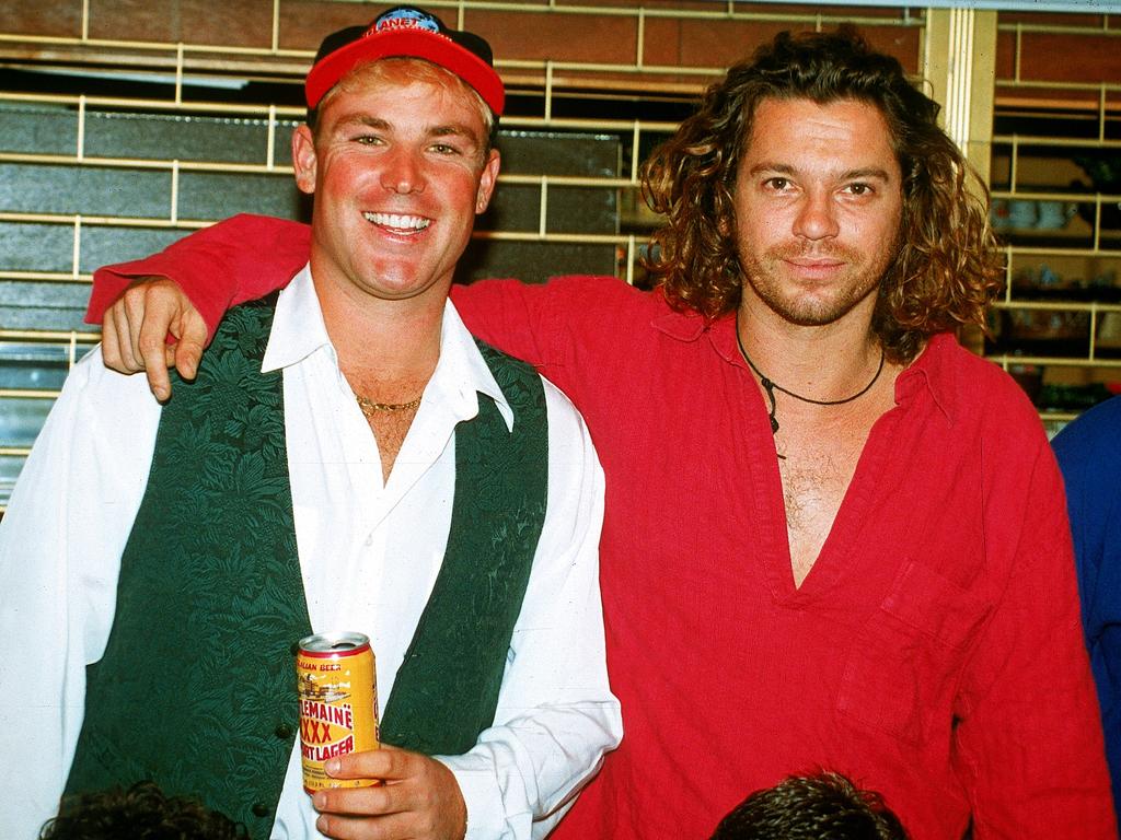 Australian cricketer Shane Warne poses for a photo with Michael Hutchence, lead singer of INXS July, 1993 in London, England. (Photo by Getty Images)