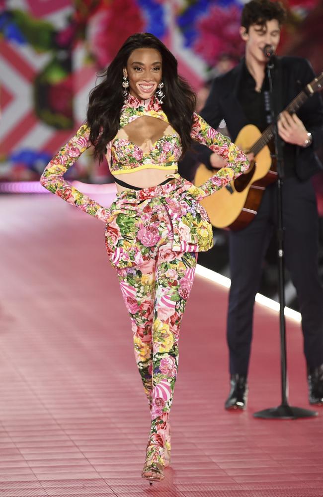 Winnie Harlow, left, walks the runway as Shawn Mendes performs during the 2018 Victoria's Secret Fashion Show at Pier 94 on Thursday, Nov. 8, 2018, in New York. (Photo by Evan Agostini/Invision/AP)