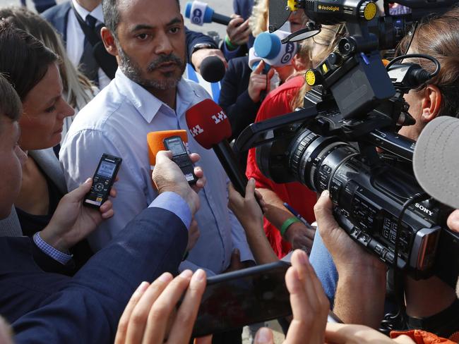 A family member is interviewed by members of the media before the release of the MH17 investigation findings. Picture: AP Photo/Peter Dejong