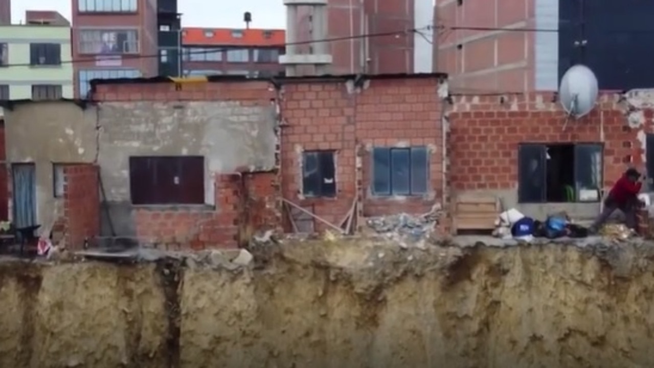 The homes are built on the edge of an earth cliff.