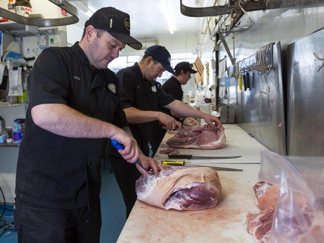 Luke Iles, Lee Robinson and Damon Whiting at work. Picture: Simon Baker