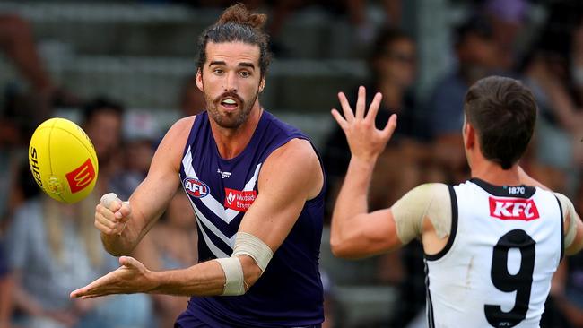 PERTH, AUSTRALIA - MARCH 02: Alex Pearce of the Dockers handballs the ball during the AFL Practice Match between the Fremantle Dockers and the Port Adelaide Power at Fremantle Oval on March 02, 2023 in Perth, Australia. (Photo by James Worsfold/AFL Photos/via Getty Images)