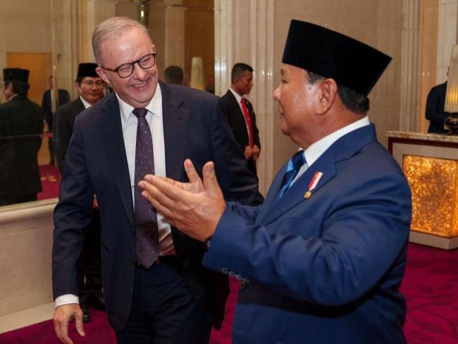 Indonesian President Prabowo Subianto greets Prime Minister Anthony Albanese in Jakarta.