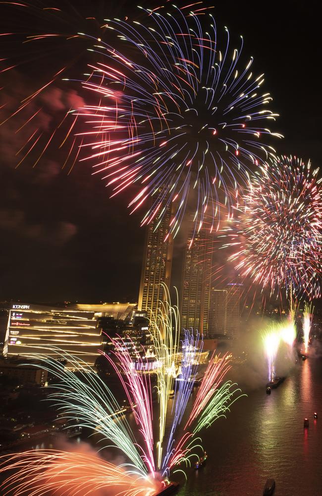 Fireworks explode over the Chao Phraya River during New Year celebrations in Bangkok, Thailand. Picture: AP